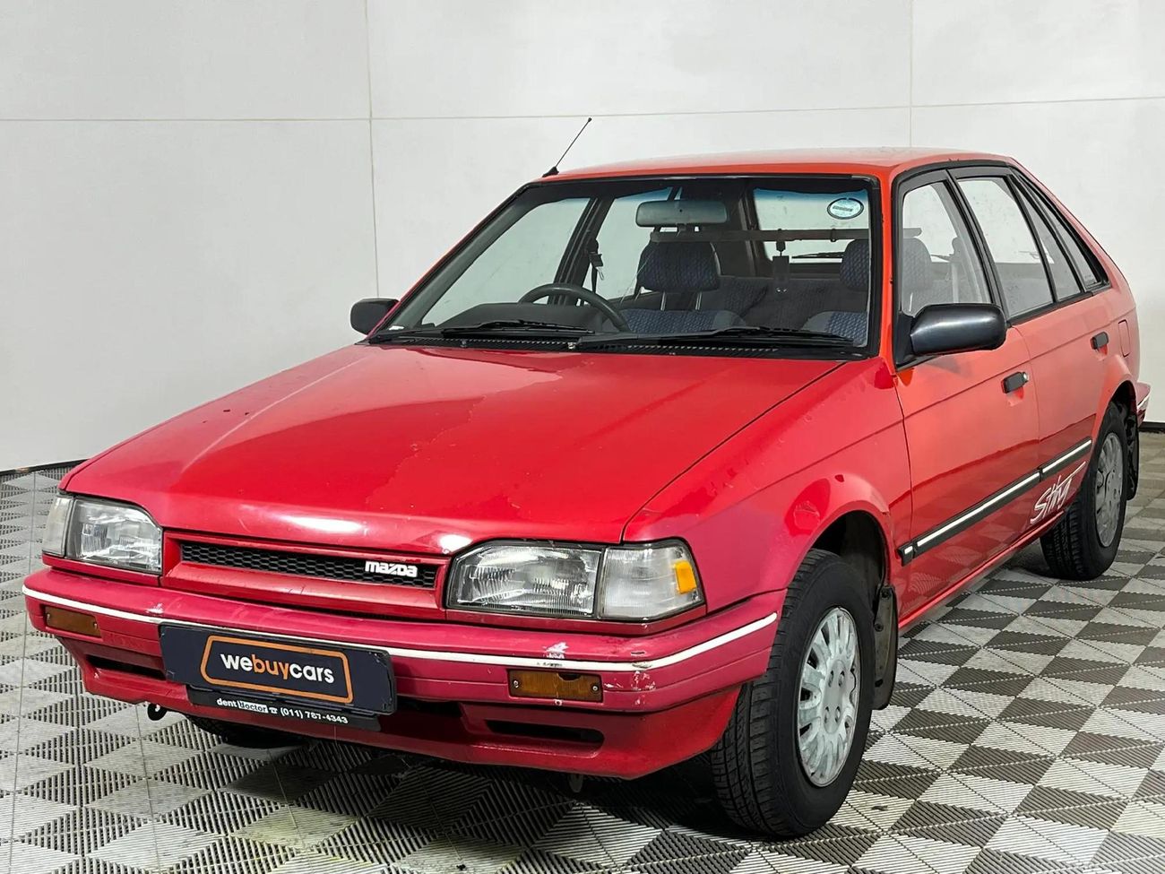 S.Tページ 1994-Mazda-323-130-Sting-Hatch