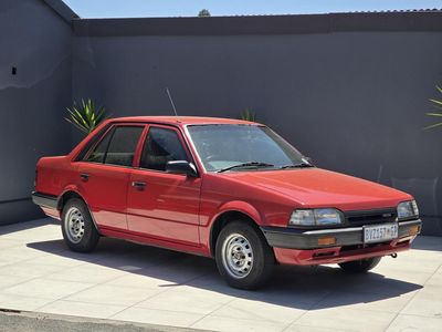 1996 Mazda 323 130 Midge Sedan