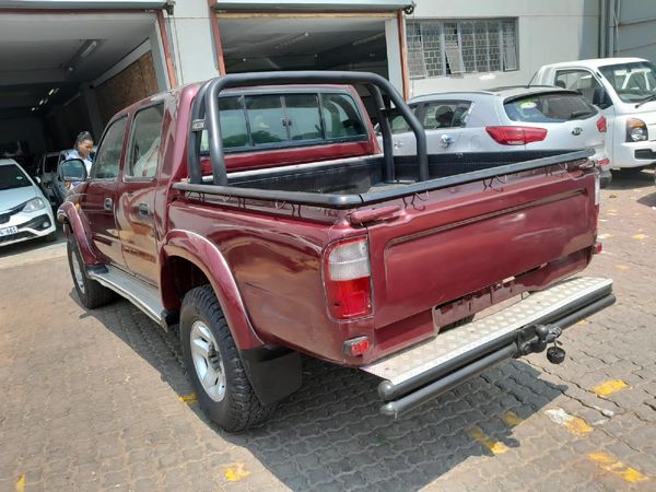 1999 maroon toyota hilux 4x4 pickup