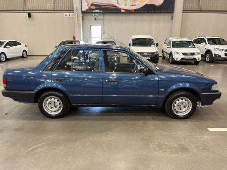 1996-Ford-Laser-13-Tracer-Sedan_1