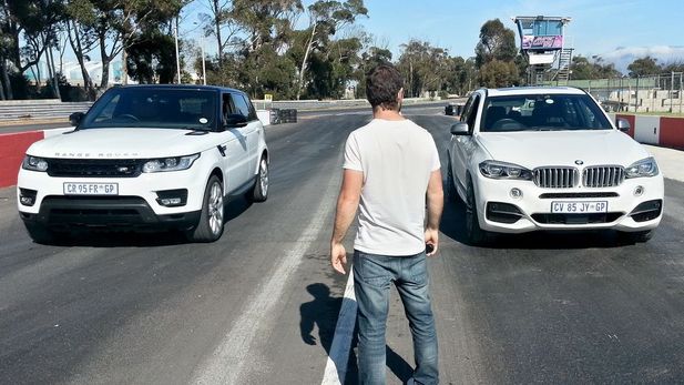 BMW X5 M50d vs Range Rover Sport (Video)
