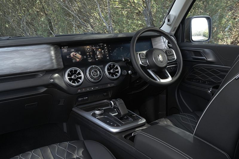 The luxurious interior of the GWM Tank 300, with brushed aluminium trim and quilted leather upholstery.
