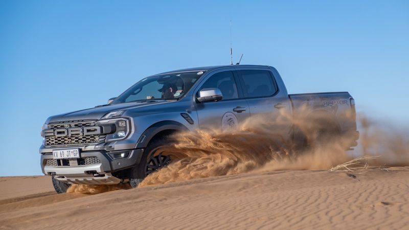 Ford Ranger Raptor carves through a desert dune.