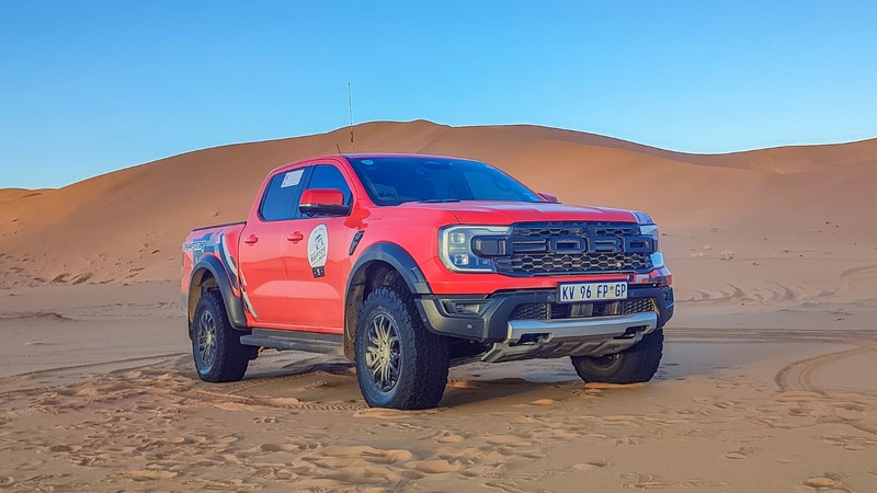 Ford Ranger Raptor front three-quarter view. Parked in the dunes of the Namib Desert.
