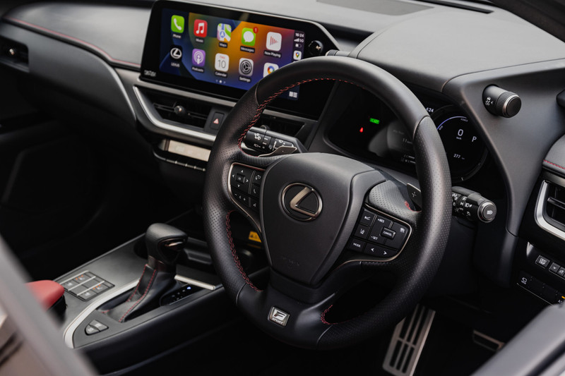 Leather trimmed cabin of the 2023 Lexus UX 250h F Sport. Note the new 12.3-inch infotainment touchscreen.
