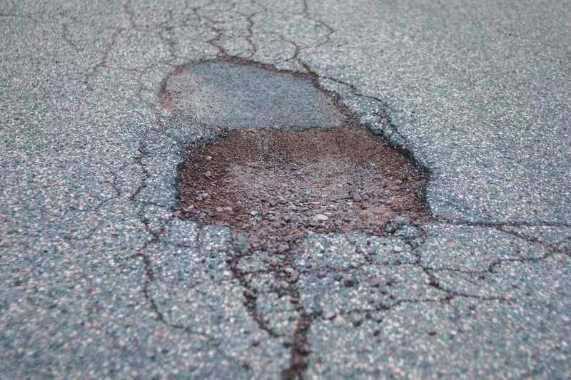 Potholes are common on South African roads and can can severe damage to cars' tyres, wheels and suspension 