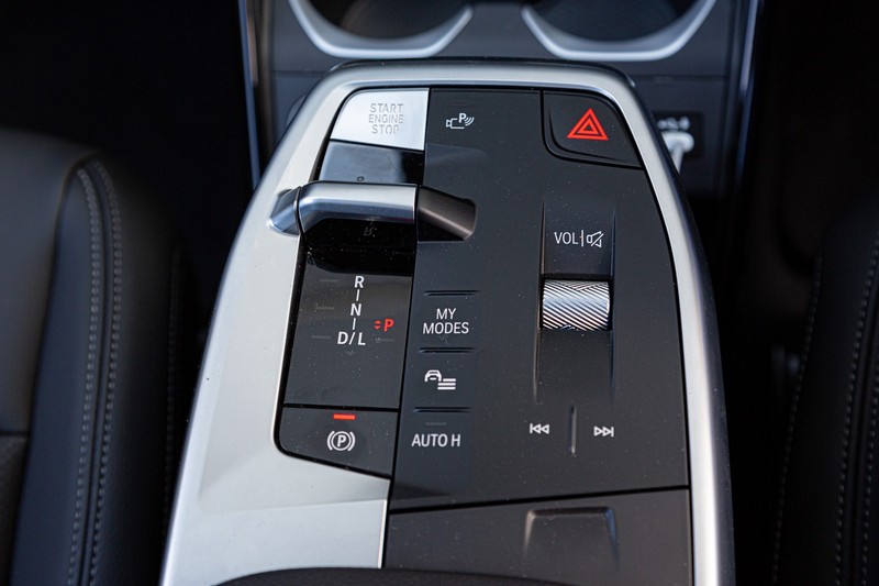 2023 BMW X1 centre console, with an electronic transmission switch. 