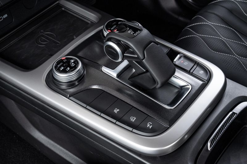 The GWM Tank 300's centre console features an ornate transmission lever and control knobs for 4x4 and drive modes.