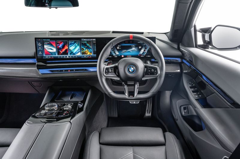 BMW i5 M60 front of cabin.