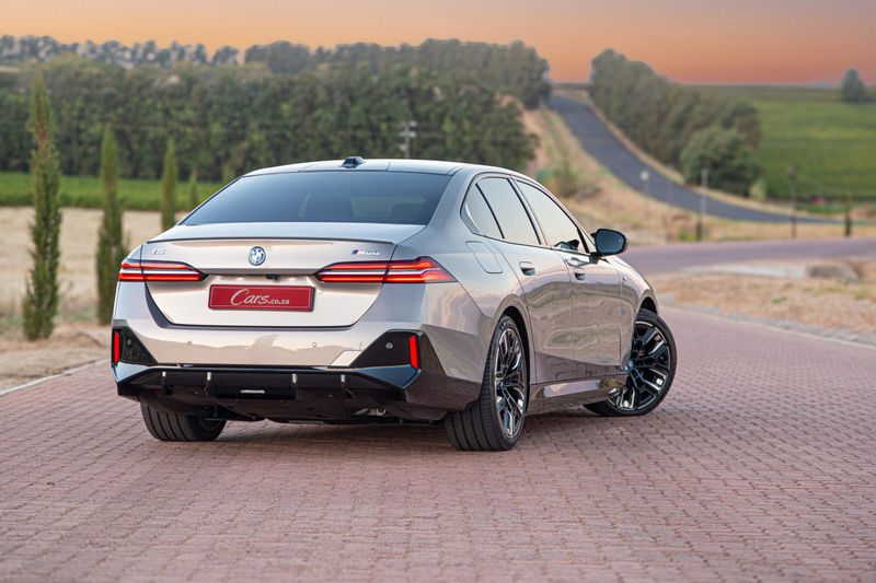 BMW i5 M60 rear three-quarter view.