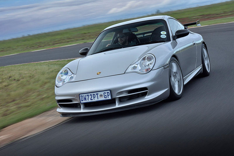 Porsche 911 (996) GT3 front three-quarter tracking shot.