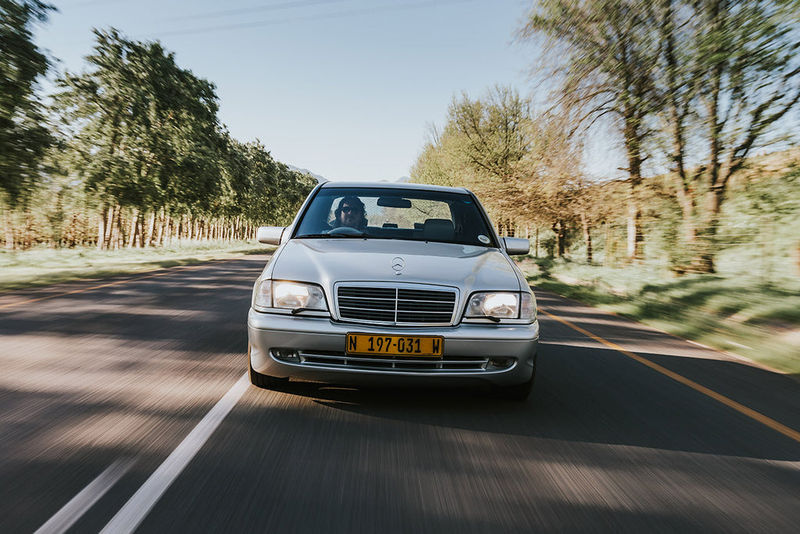 W202-series Mercedes-Benz C43 AMG front tracking shot