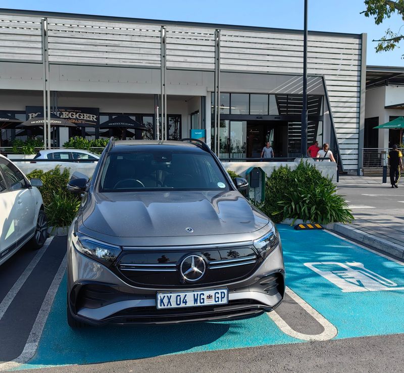 Mercedes-Benz EQB parked in a shopping centre's dedicated EV parking bay 